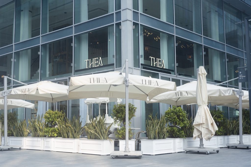 THEA restaurant terrace with white parasols