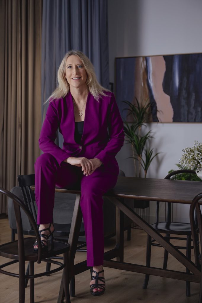 Business leader in a purple suit