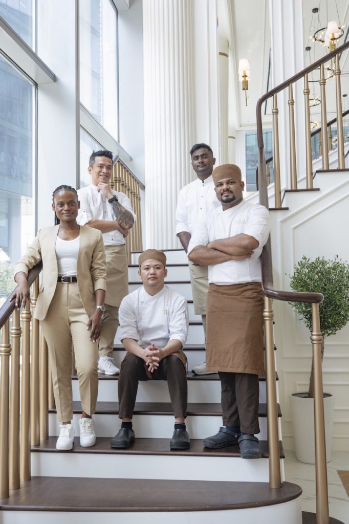 Restaurant team on a white staircase