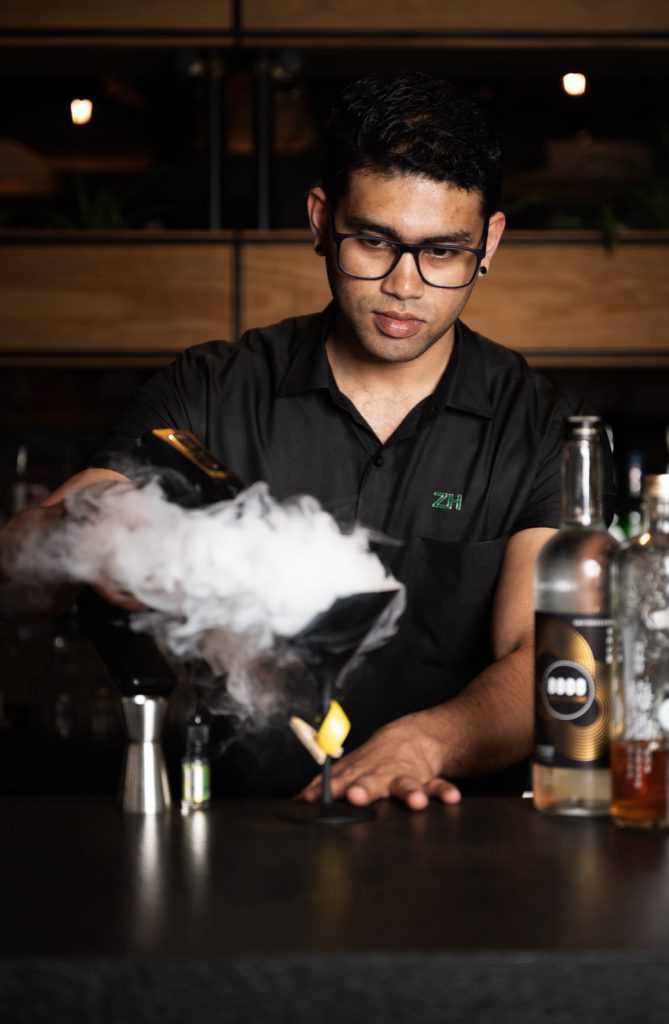 Bartender preparing a smoking cocktail