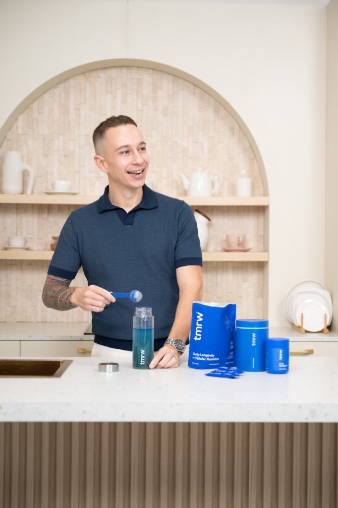 Wellness founder with his product in a kitchen