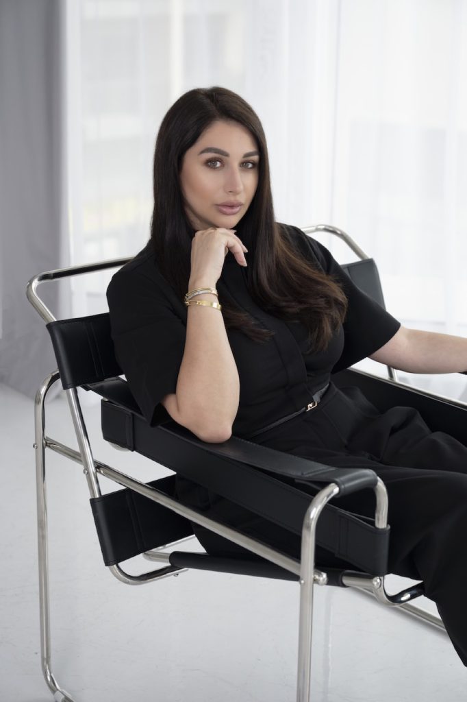 Founder in black on a leather sling chair